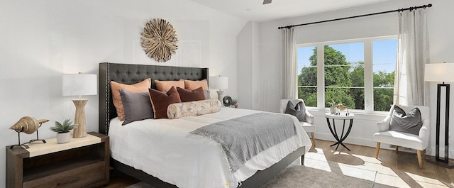 bedroom with hardwood / wood-style floors and ceiling fan