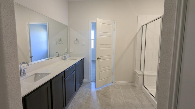 bathroom with vanity, tile patterned floors, and walk in shower