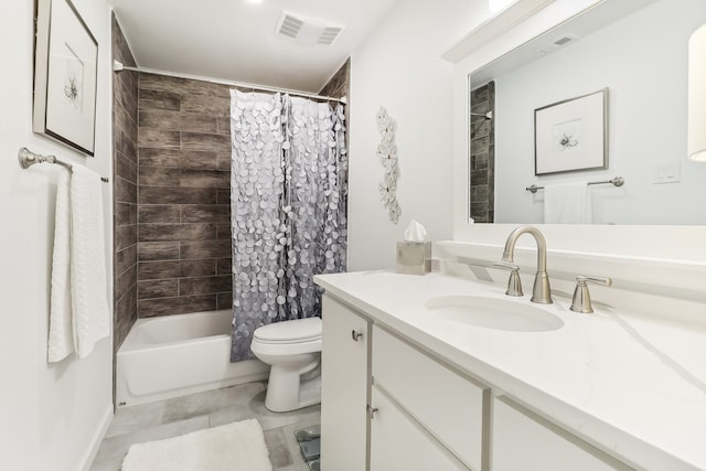 full bathroom featuring vanity, shower / tub combo with curtain, toilet, and tile patterned floors