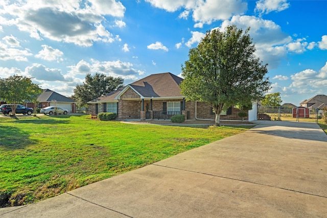 view of front of home with a front yard and covered porch