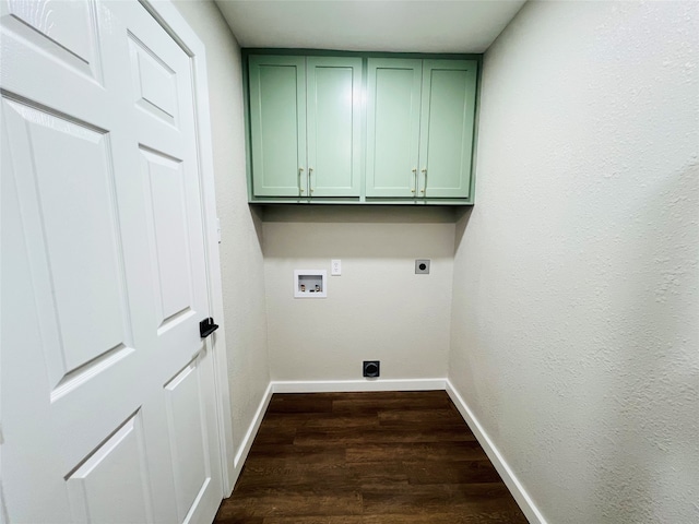 laundry room with hookup for a washing machine, electric dryer hookup, cabinets, and dark hardwood / wood-style floors