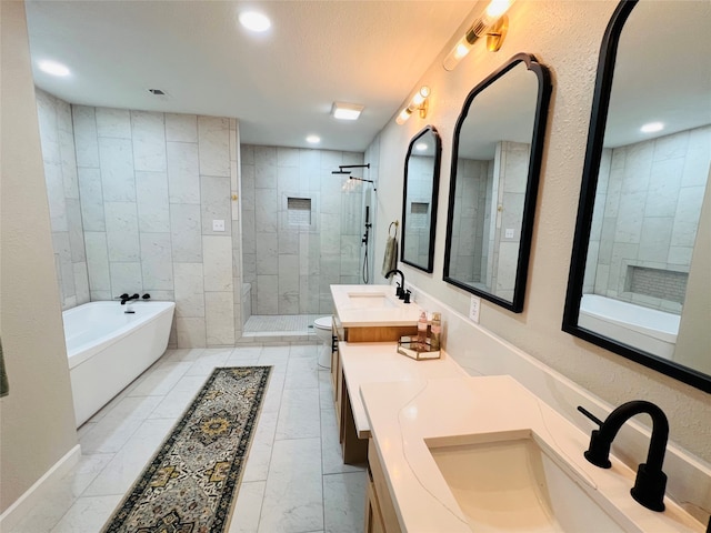 full bathroom with vanity, independent shower and bath, a textured ceiling, and toilet