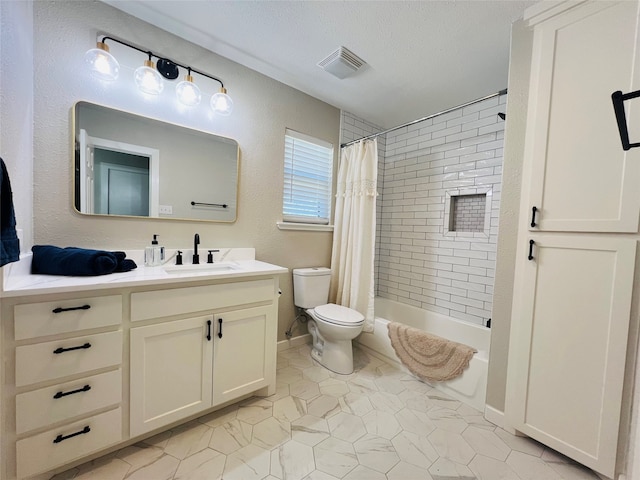 full bathroom featuring toilet, shower / bath combo, vanity, and a textured ceiling