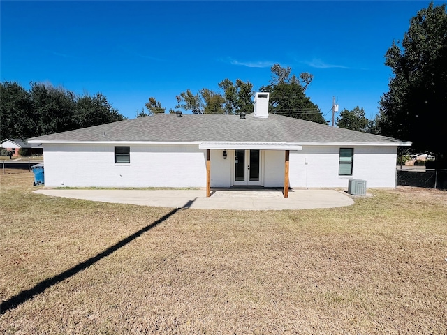 back of house featuring a patio, a yard, and central AC unit