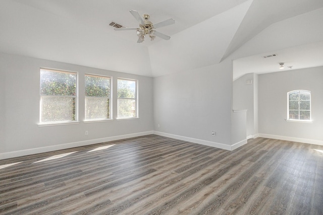 unfurnished living room with ceiling fan, dark hardwood / wood-style floors, and vaulted ceiling