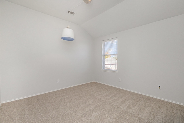 unfurnished room with lofted ceiling and carpet