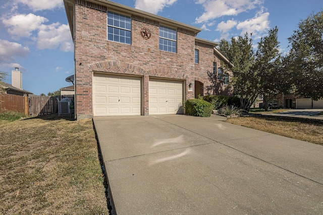 view of front property with a garage and a front yard