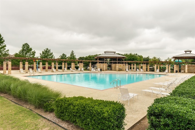 view of swimming pool featuring a gazebo and a patio area