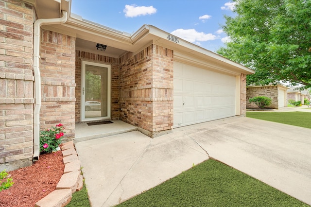 view of exterior entry featuring a garage