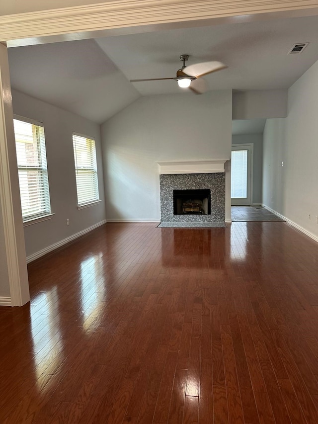 unfurnished living room featuring ceiling fan, lofted ceiling, and dark hardwood / wood-style flooring