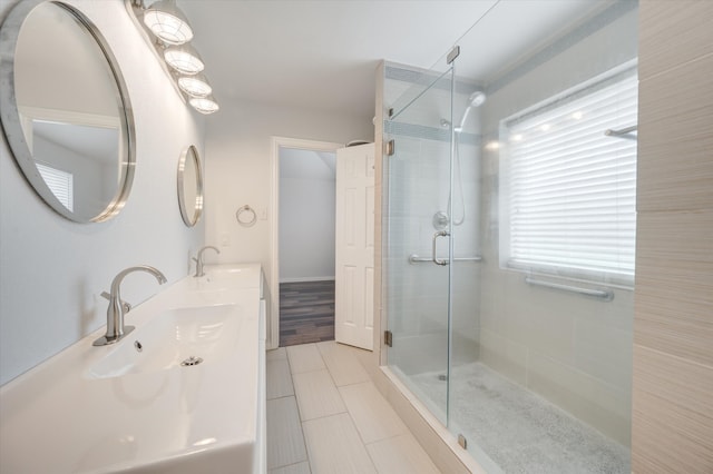 bathroom featuring vanity, hardwood / wood-style floors, and an enclosed shower