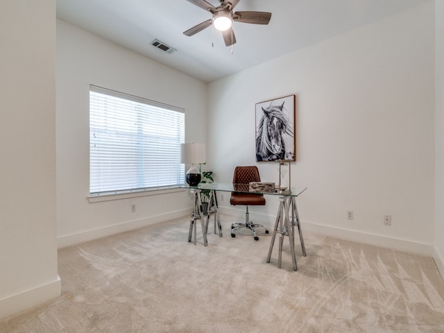 office with light colored carpet and ceiling fan