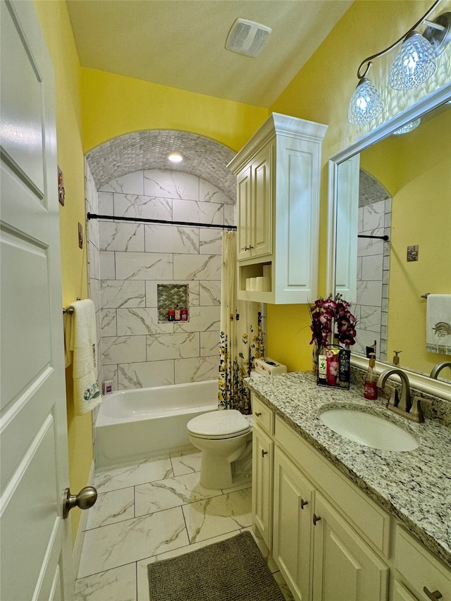 full bathroom with vanity, shower / bath combination with curtain, and toilet