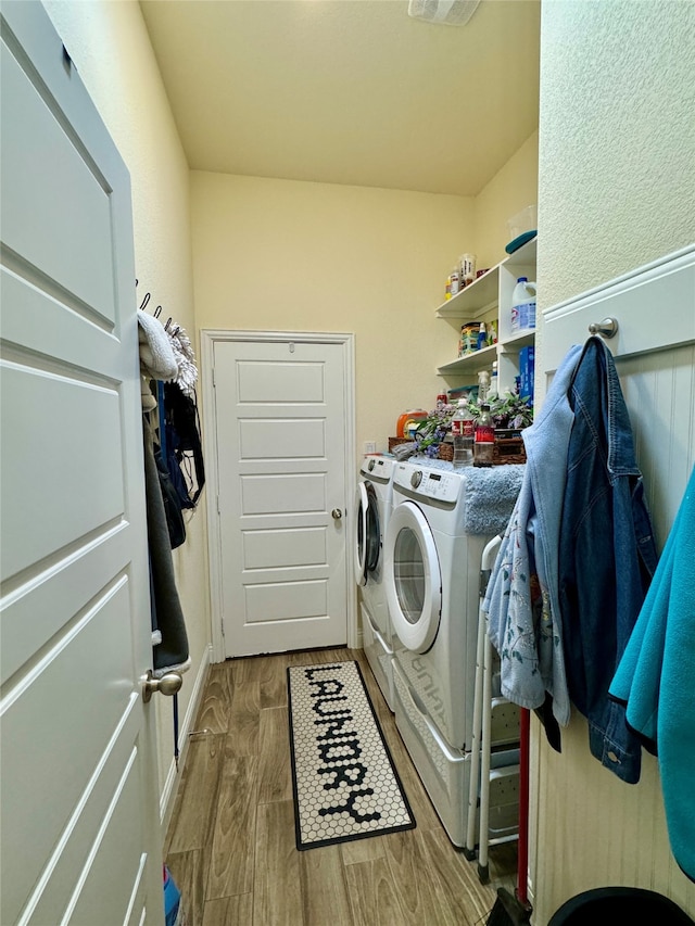 washroom featuring separate washer and dryer and hardwood / wood-style floors