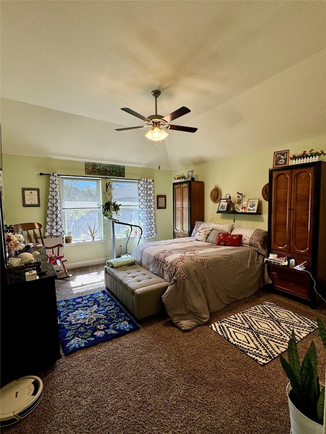 bedroom featuring a textured ceiling, carpet flooring, and ceiling fan