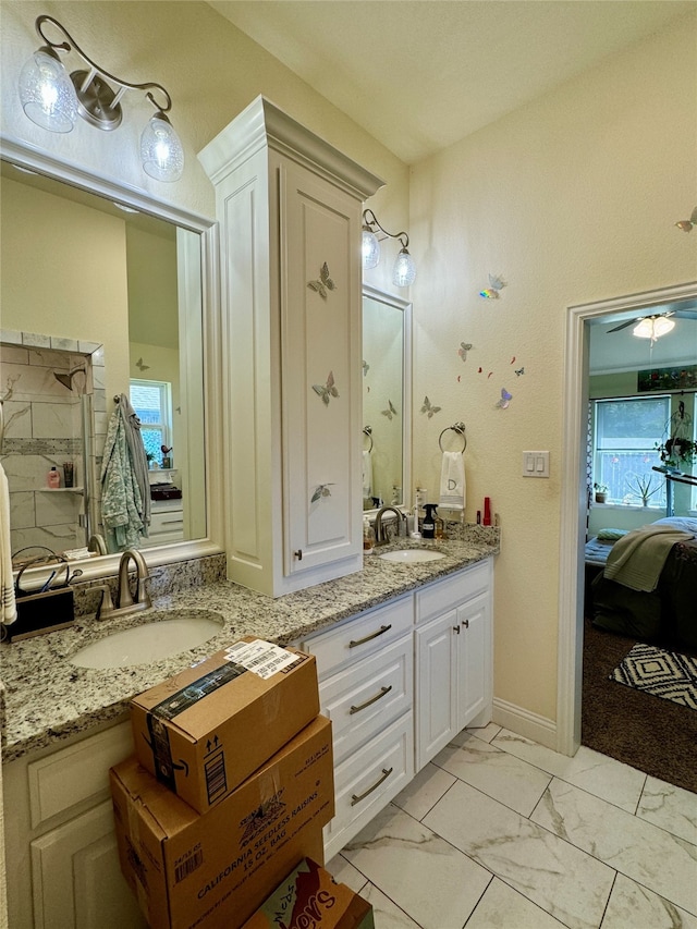 bathroom featuring vanity, ceiling fan, and a wealth of natural light