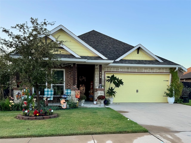 craftsman-style house with a front yard and a garage