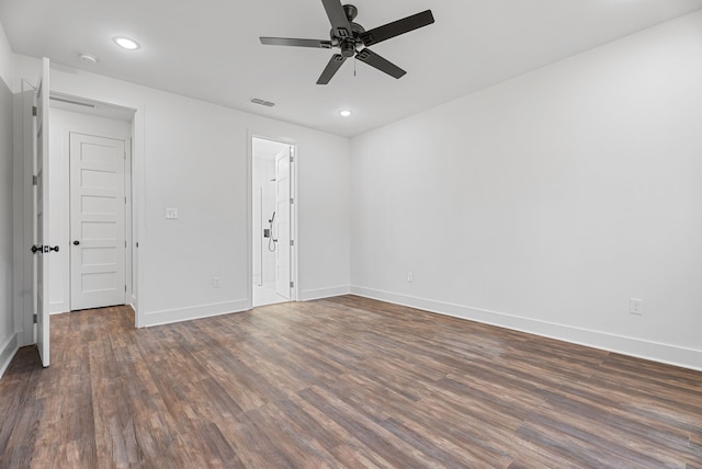 unfurnished room with dark hardwood / wood-style floors and ceiling fan