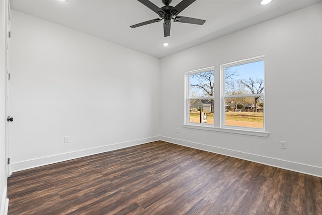 unfurnished room featuring ceiling fan and dark wood-type flooring