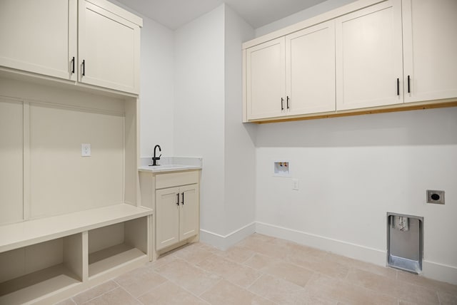 laundry area featuring electric dryer hookup, cabinets, sink, and hookup for a washing machine