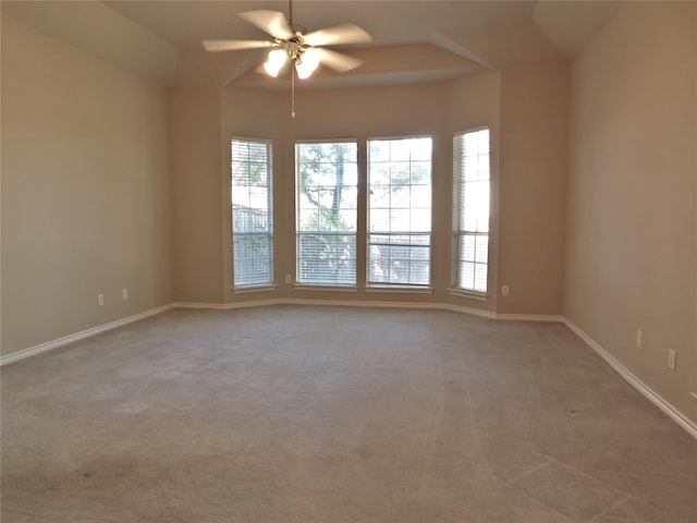 unfurnished room with ceiling fan and light colored carpet