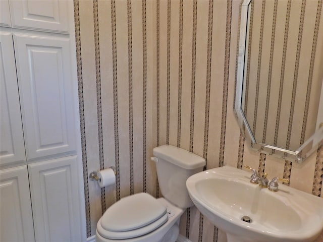 bathroom with sink and toilet