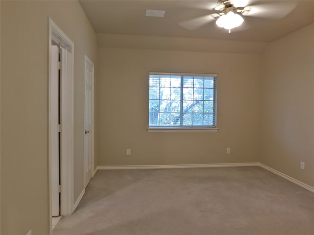 carpeted empty room with ceiling fan