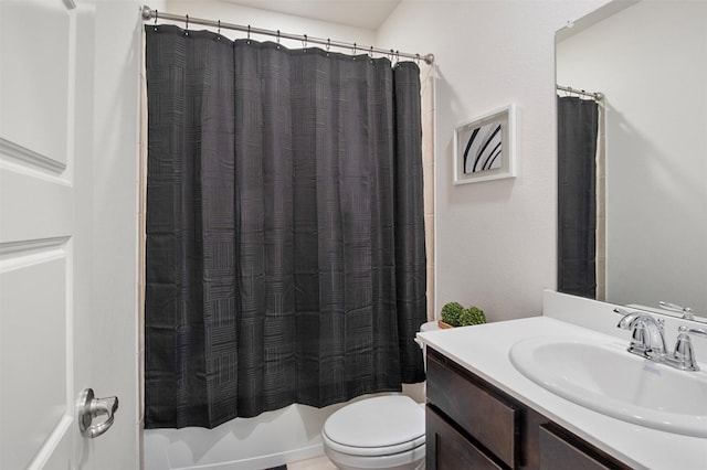 full bathroom featuring vanity, shower / bath combo, and toilet