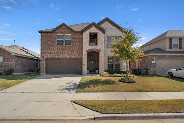 view of front of home featuring a garage and a front lawn