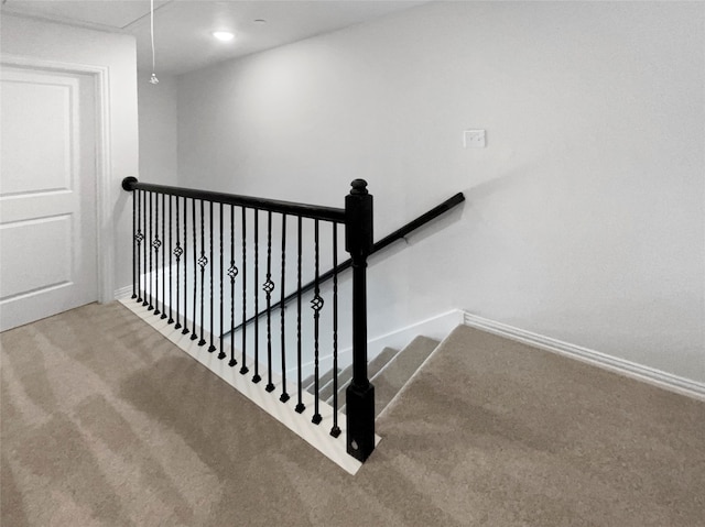 stairs featuring carpet