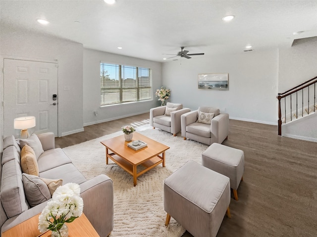 living room with hardwood / wood-style floors and ceiling fan