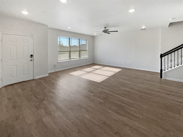 unfurnished living room with ceiling fan