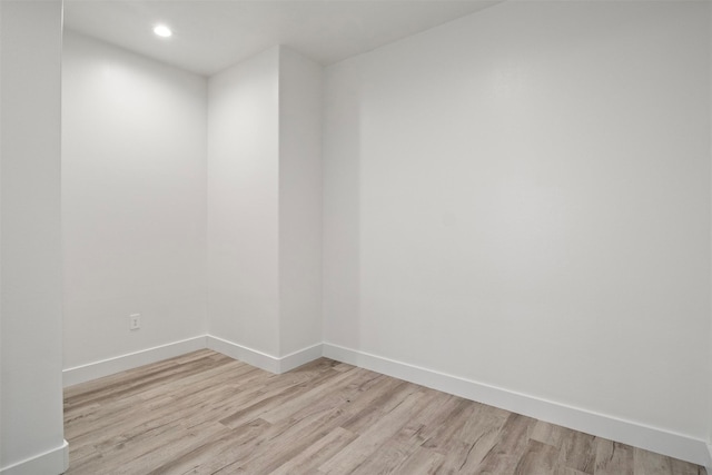 empty room with light hardwood / wood-style floors