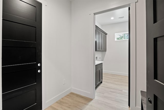 foyer entrance with light hardwood / wood-style floors