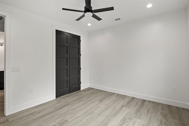 unfurnished room featuring ceiling fan and light hardwood / wood-style floors