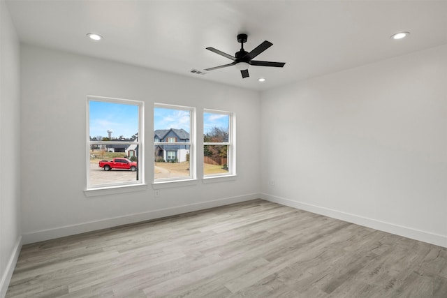 unfurnished room featuring ceiling fan and light hardwood / wood-style flooring