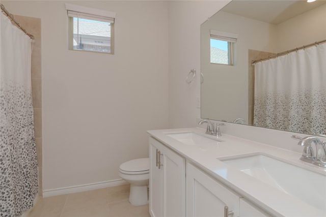 bathroom with tile patterned flooring, vanity, curtained shower, and toilet