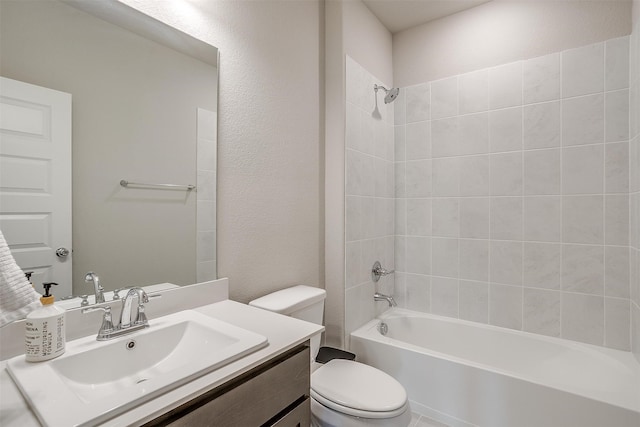 full bathroom with vanity, toilet, and tiled shower / bath combo