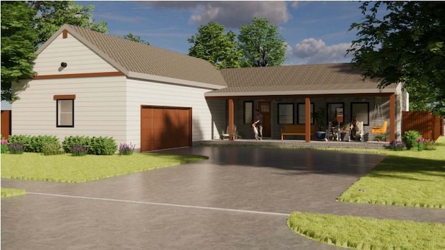 view of front of home featuring a porch, a front yard, and a garage