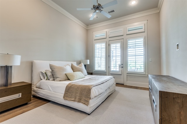 bedroom with light hardwood / wood-style floors, crown molding, access to exterior, and ceiling fan