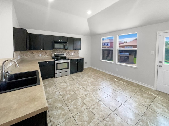 kitchen with lofted ceiling, backsplash, sink, light tile patterned floors, and stainless steel electric range oven