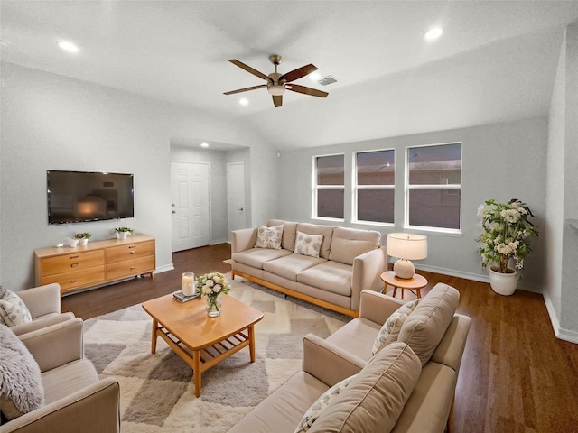 living room featuring a ceiling fan, baseboards, wood finished floors, vaulted ceiling, and visible vents