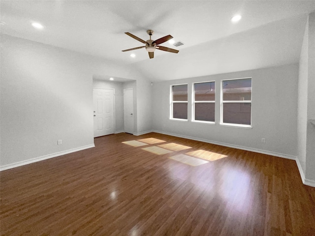 empty room featuring baseboards, a ceiling fan, wood finished floors, and lofted ceiling