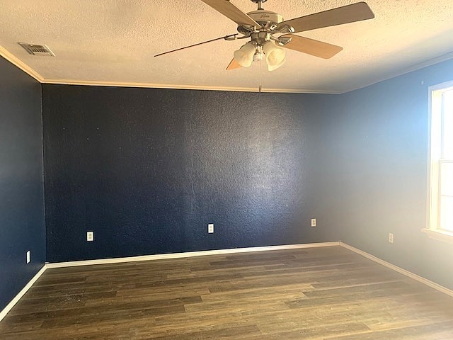 unfurnished room featuring wood-type flooring, a textured ceiling, ceiling fan, vaulted ceiling, and crown molding