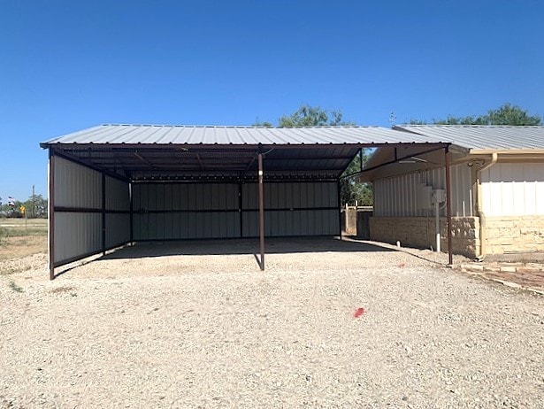 exterior space with a carport