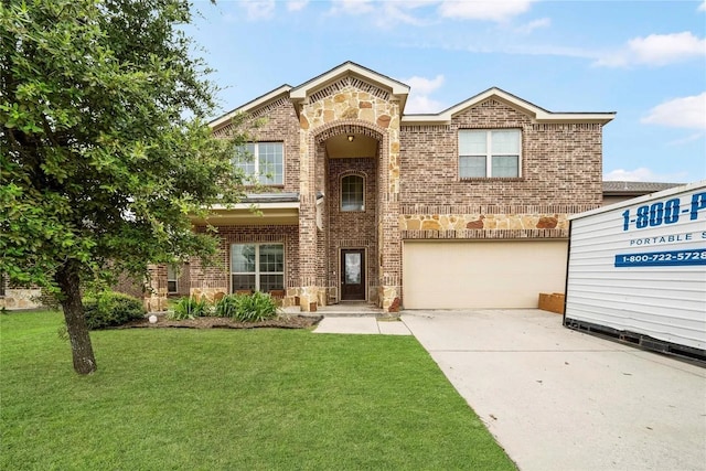 view of front of home featuring a front yard and a garage