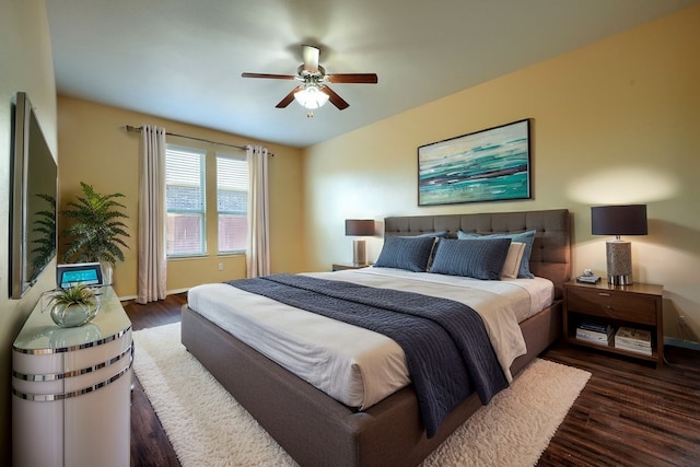 bedroom featuring dark wood-type flooring and ceiling fan