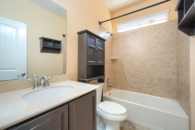 full bathroom featuring vanity, toilet, tiled shower / bath combo, and tile patterned flooring