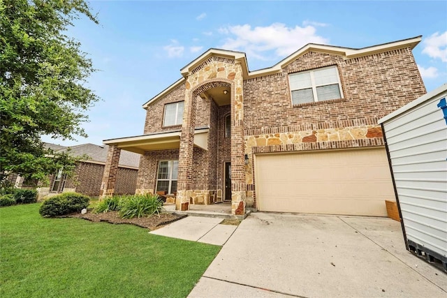 view of front of home featuring a front lawn and a garage