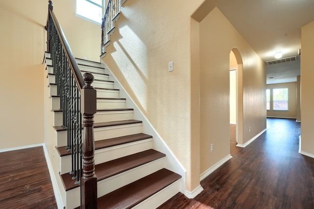 stairs with wood-type flooring